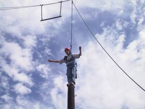 Henry on top of the pole, getting ready to jump